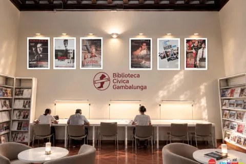 Rendering allestimento cineteca spazio lettura